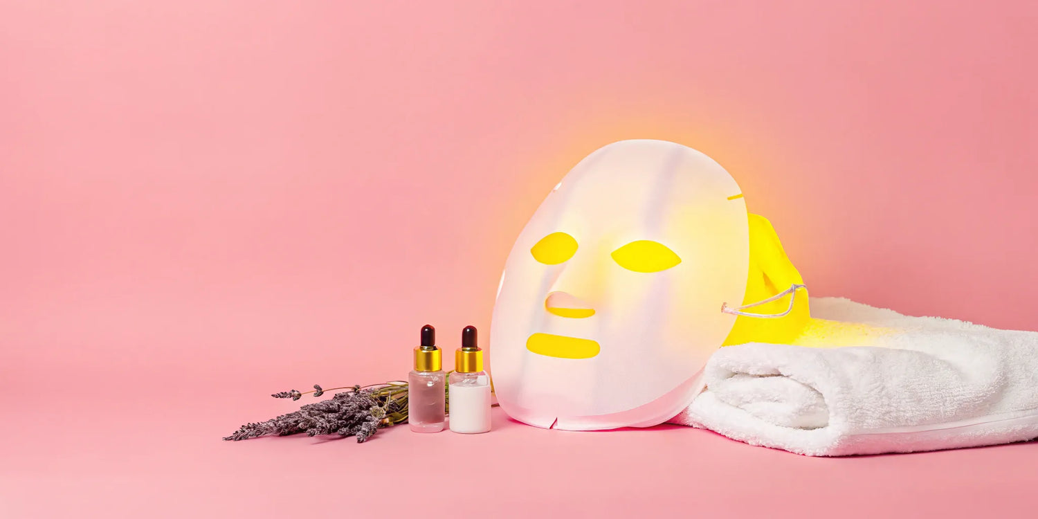 LED facial mask emitting yellow light.