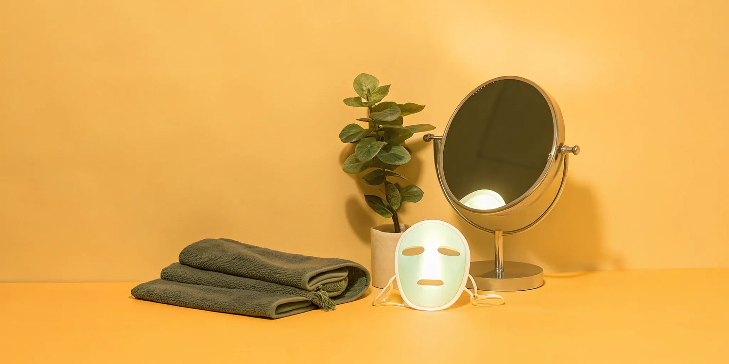 Green LED light therapy mask for dark spot treatment.