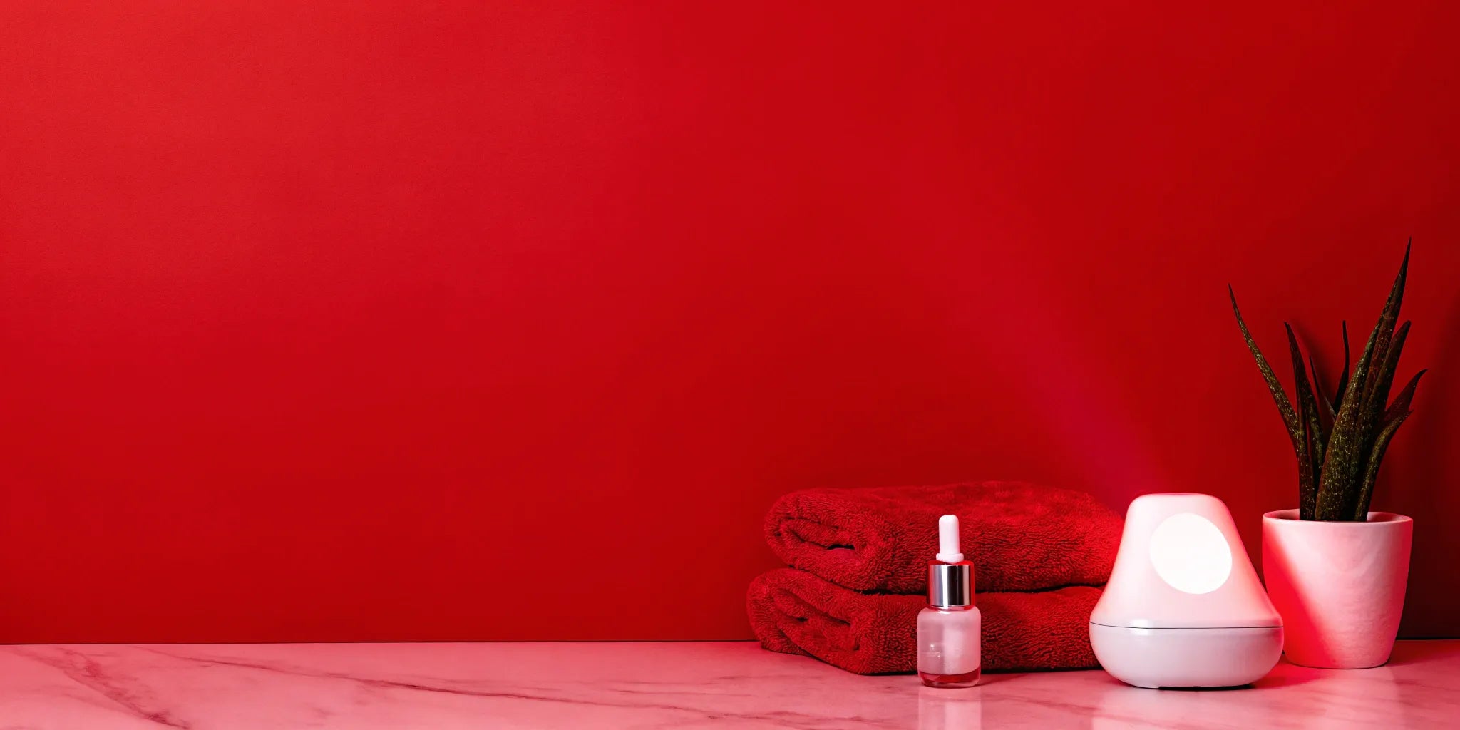 At-home red light therapy device for treating dark spots, paired with a skincare serum.