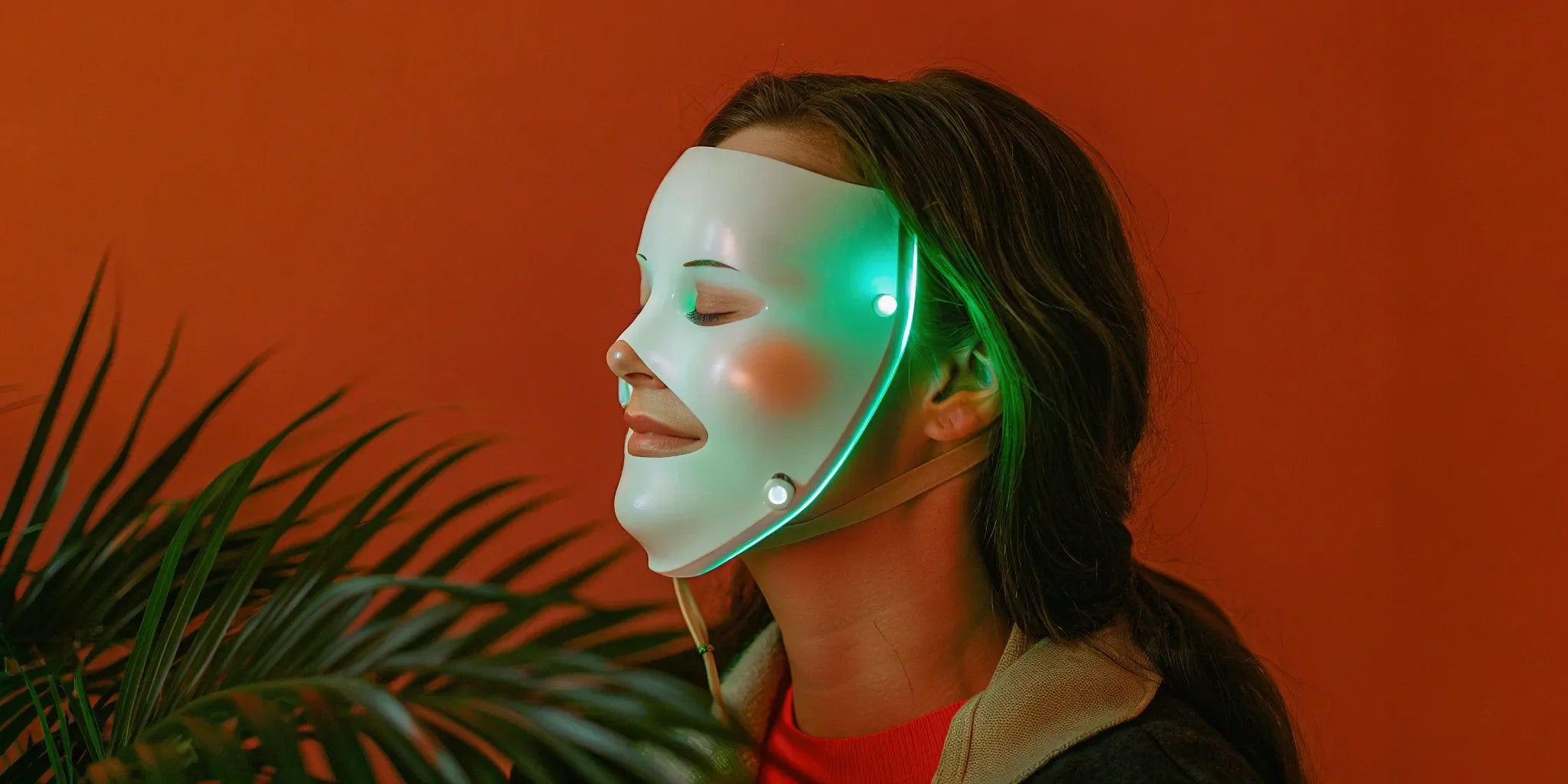Woman using a top-rated LED mask for wrinkles and anti-aging.